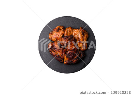 Chicken or turkey, poultry breast baked on the grill or barbecue. Grilled chicken Chicken or turkey, poultry breast baked on the grill or barbecue. Grilled chicken 139910238