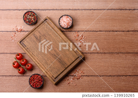 Empty wooden cutting board for preparing ingredients for home cooking. An empty cutting board Empty wooden cutting board for preparing ingredients for home cooking. An empty cutting board 139910265