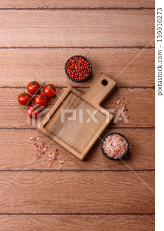 Empty wooden cutting board for preparing ingredients for home cooking. An empty cutting board Empty wooden cutting board for preparing ingredients for home cooking. An empty cutting board 139910273