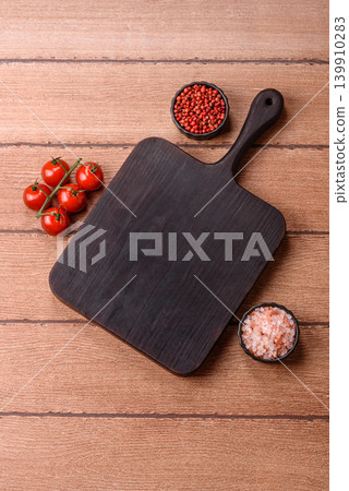 Empty wooden cutting board for preparing ingredients for home cooking. An empty cutting board 139910283