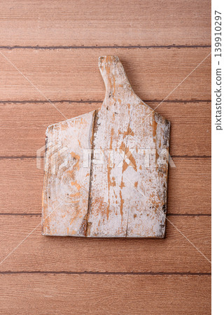 Empty wooden cutting board for preparing ingredients for home cooking. An empty cutting board Empty wooden cutting board for preparing ingredients for home cooking. An empty cutting board 139910297