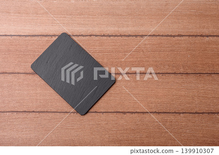 An empty slate cutting board for preparing ingredients for home cooking. An empty cutting board An empty slate cutting board for preparing ingredients for home cooking. An empty cutting board 139910307