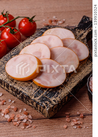 Slices of cooked chicken sausage for sandwiches and antipasto for dinner. Sausage slices 139910324