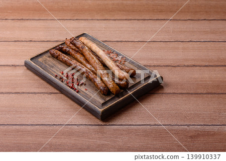 Thin chicken or pork sausages grilled or barbecued. Grilled sausages 139910337