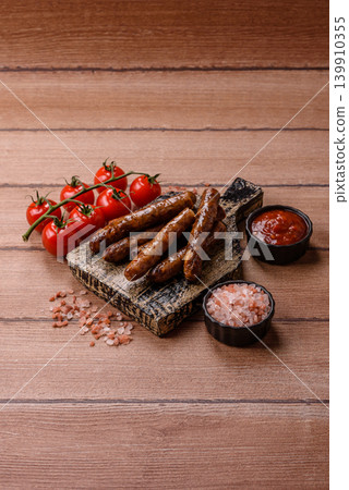 Thin chicken or pork sausages grilled or barbecued. Grilled sausages Thin chicken or pork sausages grilled or barbecued. Grilled sausages 139910355
