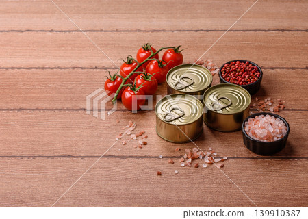 A metal tin can of meat, fish, or dog or cat food. A tin can of food A metal tin can of meat, fish, or dog or cat food. A tin can of food 139910387