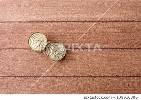 A metal tin can of meat, fish, or dog or cat food. A tin can of food A metal tin can of meat, fish, or dog or cat food. A tin can of food 139910390