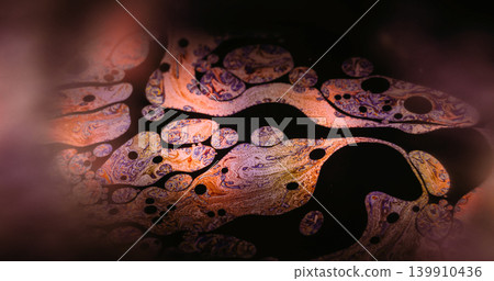 Gasoline rainbow. Paint mix. Defocused orange purple colorful round oil texture chemical drop liquid spill on abstract dark black art background. Gasoline rainbow. Paint mix. Defocused orange purple colorful round oil texture chemical drop liquid spill on abstract dark black art background. 139910436