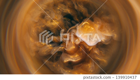 Vapor texture. Blur paint art. Defocused yellow golden color glitter liquid swirling water floating on abstract creative background. Vapor texture. Blur paint art. Defocused yellow golden color glitter liquid swirling water floating on abstract creative background. 139910437
