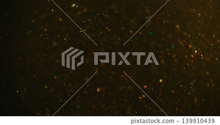 Bokeh circles. Glitter fly illumination. Yellow sparks mix stream on black abstract background. Golden color dots blur night texture. Bokeh circles. Glitter fly illumination. Yellow sparks mix stream on black abstract background. Golden color dots blur night texture. 139910439