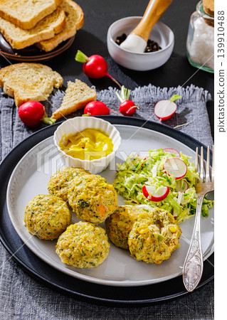 baked meat and vegetable polpette on a plate baked meat and vegetable polpette on a plate 139910488