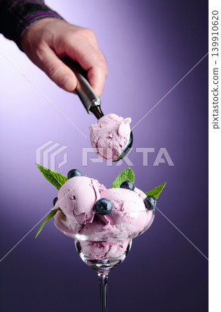 Blueberry ice cream with mint and berries. Blueberry ice cream with mint and berries. 139910620