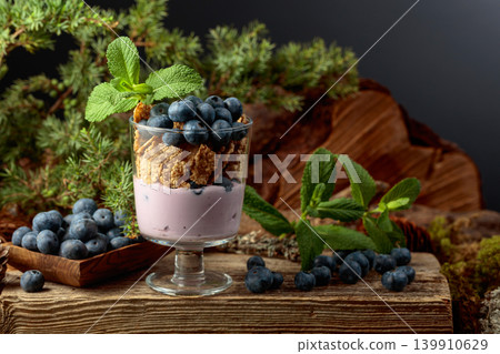 Blueberry dessert with rye flakes, mint and fresh berries. Blueberry dessert with rye flakes, mint and fresh berries. 139910629