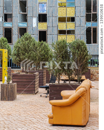 Surviving furniture in courtyard of house bombed by russian missile Surviving furniture in courtyard of house bombed by russian missile 139910638