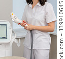 A female technician in a white uniform 139910645
