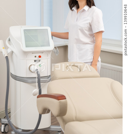 Close-up of a female cosmetologist in a white uniform 139910648