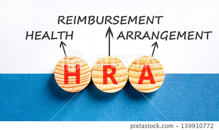 HRA health reimbursement arrangement symbol. Concept words HRA health reimbursement arrangement on beautiful wooden circles. Beautiful white blue background. Medical HRA concept. Copy space. 139910772