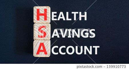 HSA health saving account symbol. Concept words HSA health saving account on beautiful wooden blocks. Beautiful black background. Medical HSA health saving account concept. Copy space. HSA health saving account symbol. Concept words HSA health saving account on beautiful wooden blocks. Beautiful black background. Medical HSA health saving account concept. Copy space. 139910773