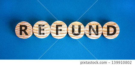 Refund word symbol. Concept word Refund on beautiful wooden circles. Beautiful blue background. Business word refund concept. Copy space. Refund word symbol. Concept word Refund on beautiful wooden circles. Beautiful blue background. Business word refund concept. Copy space. 139910802