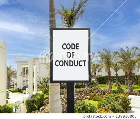 Code of conduct words symbol. Concept words Code of conduct on beautiful white sign. Beautiful hotel garden blue sky background. Business Code of conduct concept. Copy space. Code of conduct words symbol. Concept words Code of conduct on beautiful white sign. Beautiful hotel garden blue sky background. Business Code of conduct concept. Copy space. 139910805
