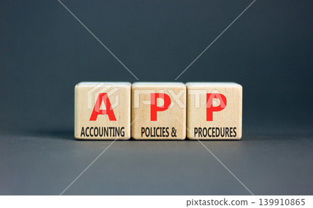 APP accounting policies and procedures symbol. Concept words APP accounting policies and procedures on beautiful wooden blocks. Beautiful grey background. Business APP concept. Copy space. 139910865