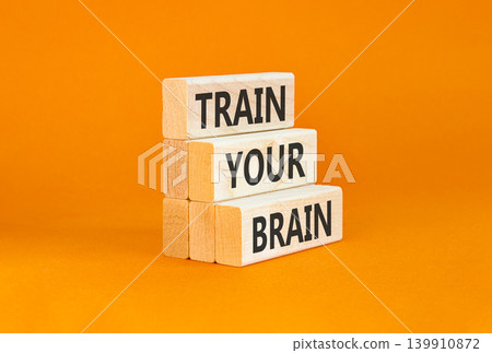 Train your brain words symbol. Concept words Train your brain on beautiful wooden blocks. Beautiful orange background. Business motivational and train your brain concept. Copy space Train your brain words symbol. Concept words Train your brain on beautiful wooden blocks. Beautiful orange background. Business motivational and train your brain concept. Copy space 139910872