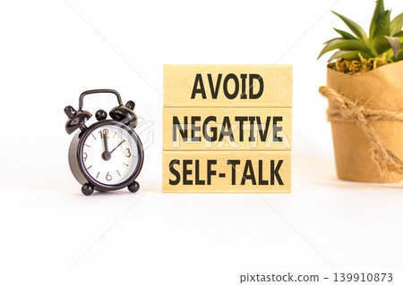 Avoid negative self-talk symbol. Concept words Avoid negative self-talk on beautiful wooden blocks. Beautiful white background. Business psychology avoid negative self-talk concept. Copy space. Avoid negative self-talk symbol. Concept words Avoid negative self-talk on beautiful wooden blocks. Beautiful white background. Business psychology avoid negative self-talk concept. Copy space. 139910873