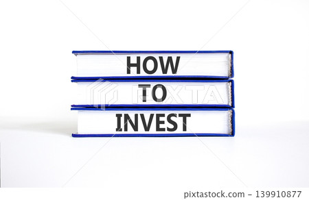 How to invest words symbol. Concept words How to invest on beautiful books. Beautiful white table white background. Business and how to invest concept. Copy space. How to invest words symbol. Concept words How to invest on beautiful books. Beautiful white table white background. Business and how to invest concept. Copy space. 139910877