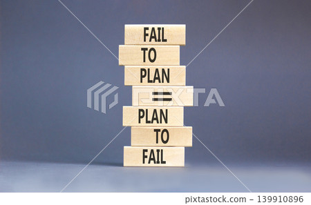 Planning to fail symbol. Concept words Fail to plan is plan to fail on beautiful wooden blocks. Beautiful grey paper background. Business planning to fail concept. Copy space. 139910896