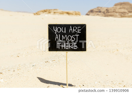 You are almost there words symbol. Concept words You are almost there on beautiful blackboard. Beautiful desert sand background. Business You are almost there motivational support concept. Copy space. You are almost there words symbol. Concept words You are almost there on beautiful blackboard. Beautiful desert sand background. Business You are almost there motivational support concept. Copy space. 139910906