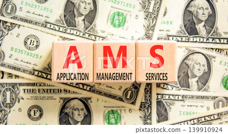 AMS application management services symbol. Concept words AMS application management services on beautiful wooden blocks. Beautiful dollar bills background. Business AMS concept. Copy space. 139910924