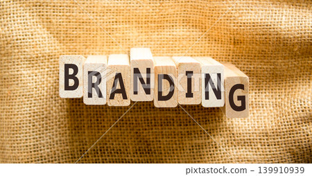 Branding brand word symbol. Concept word Branding on beautiful wooden blocks. Beautiful canvas background. Business support help branding brand word concept. Copy space. Branding brand word symbol. Concept word Branding on beautiful wooden blocks. Beautiful canvas background. Business support help branding brand word concept. Copy space. 139910939
