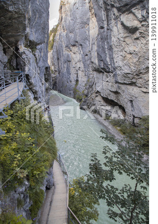 Aare gorge river flowing between high cliffs Aare gorge river flowing between high cliffs 139911018