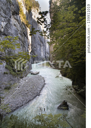 Aare gorge river flowing through narrow limestone canyon 139911019