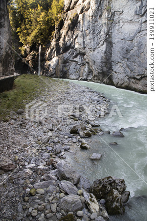 Aare gorge river flowing through mountain canyon Aare gorge river flowing through mountain canyon 139911021