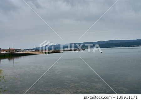Clean docks and piers awaiting boats in the Rianxo maritime port in Galicia Clean docks and piers awaiting boats in the Rianxo maritime port in Galicia 139911171