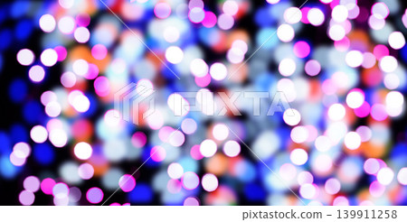A blurred black background with bright circular bokeh lights in blue, purple, pink and white tones A blurred black background with bright circular bokeh lights in blue, purple, pink and white tones 139911258