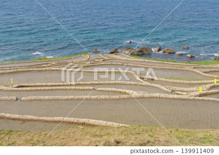 The Shiroyone Senmaida rice terraces before rice planting, May 2023. The Shiroyone Senmaida rice terraces before rice planting, May 2023. 139911409