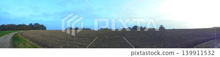 Wide angle panoramic image of bare autumn field during sunny weather 139911532