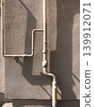 steel gas pipeline against a wall 139912071
