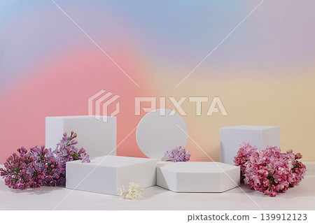 Aesthetically pleasing cosmetic display case with floral decor for showcasing beauty products. Abstract floral arrangement with podiums and lilac blossoms. Minimalistic, modern design. Aesthetically pleasing cosmetic display case with floral decor for showcasing beauty products. Abstract floral arrangement with podiums and lilac blossoms. Minimalistic, modern design. 139912123