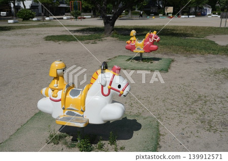 Playground equipment in the park: Spring riders 139912571