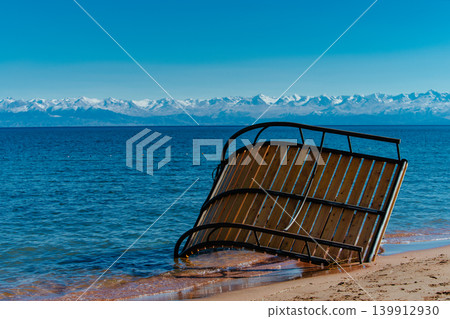 Overturned sun lounger on the beach after the storm Overturned sun lounger on the beach after the storm 139912930