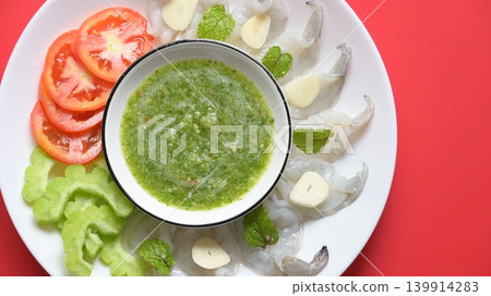 shrimp in fish sauce with Thai spicy seafood dipping sauce on white plate shrimp in fish sauce with Thai spicy seafood dipping sauce on white plate 139914283