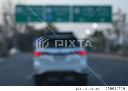 highway traffic with safety barrier on road asphalt, blurred image highway traffic with safety barrier on road asphalt, blurred image 139914519