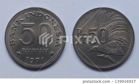An old Indonesian 50 Rupiah coin from 1971 depicting the Bird of Paradise. An old Indonesian 50 Rupiah coin from 1971 depicting the Bird of Paradise. 139916937