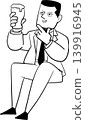 A man sitting and drinking alcohol 139916945