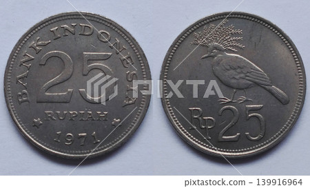 An old Indonesian 25 Rupiah coin from 1971 depicting the Bird of Paradise. An old Indonesian 25 Rupiah coin from 1971 depicting the Bird of Paradise. 139916964