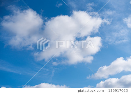 Blue sky with white clouds, cloudscape background in daytime, sunny weather in England Blue sky with white clouds, cloudscape background in daytime, sunny weather in England 139917023