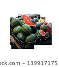 A large pile of watermelons for sale, some of which have been cut into wedges to show their bright red flesh. . High quality photo 139917175